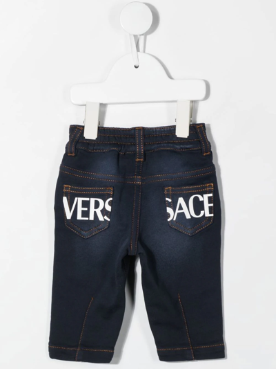 Shop Versace Logo-print Straight-leg Jeans In Blue