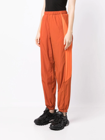 Y-3 Contrasting-panel Tracksuit Bottom In Orange