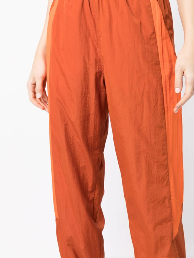 Y-3 Contrasting-panel Tracksuit Bottom In Orange