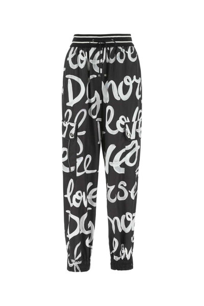 Shop Dolce & Gabbana Printed Elasticated Waistband Pants In Hntrw Dg Love Yourself Fdo Nero