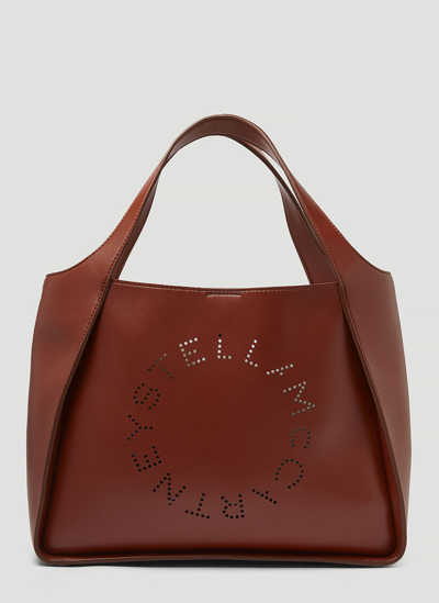 Shop Stella Mccartney Perforated Logo Tote Bag In Brown
