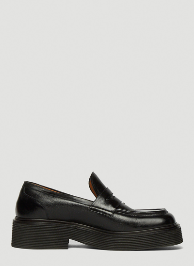 Shop Marni Pierced Penny Loafers In Black