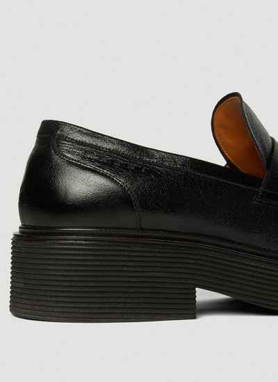 Shop Marni Pierced Penny Loafers In Black