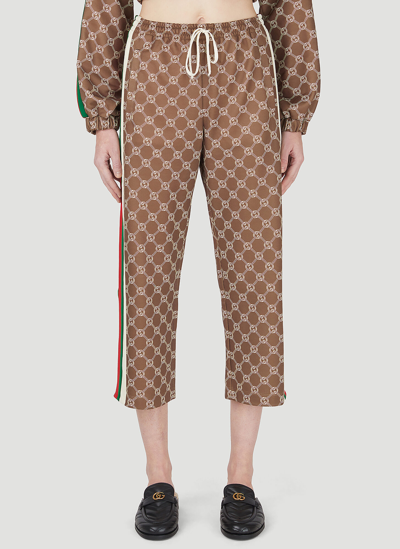 Shop Gucci Interlocking G Cropped Track Pants In Brown