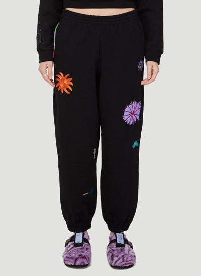 Shop Mcq By Alexander Mcqueen Embroidered Track Pants In Black