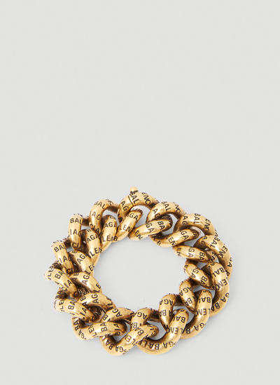 Shop Balenciaga Debossed Logo Bracelet In Gold