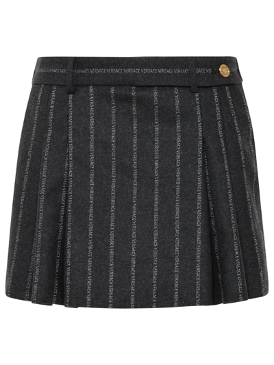 Shop Versace Allover Logo Printed Pleated Mini Skirt In Grey