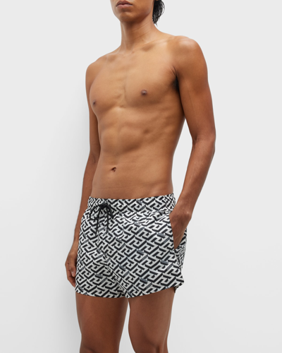 Shop Versace Men's Greca Mono Swim Shorts In White/black