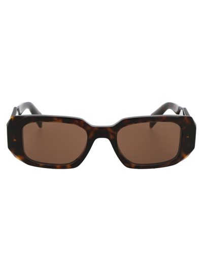Shop Prada Eyewear Rectangular Frame Sunglasses In Brown