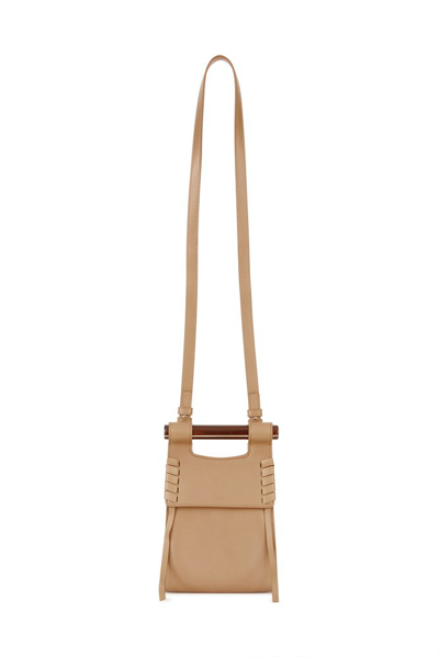 Shop Chloé Logo Embossed Phone Pouch In Beige