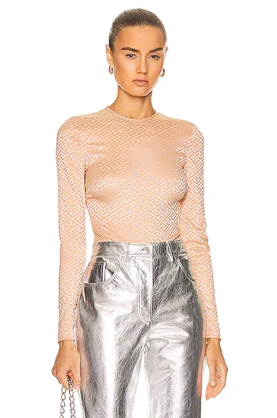 Shop Versace Long Sleeve Monogram Bodysuit In Pale Nude