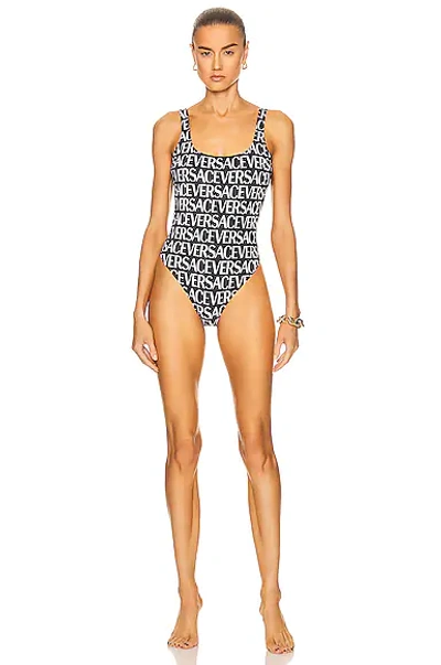 Shop Versace All Over Logo One Piece Swimsuit In Nero & Bianco
