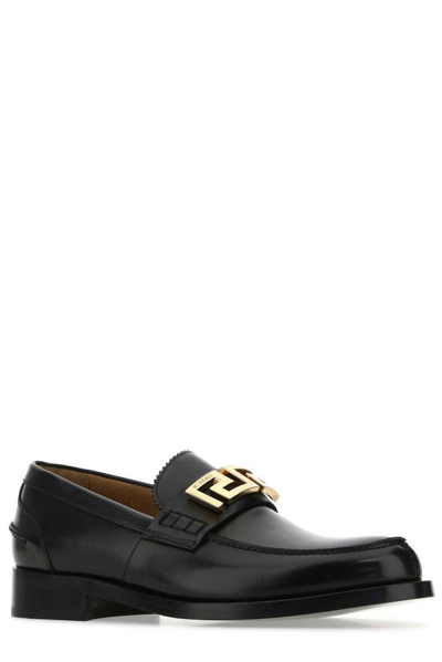 Shop Versace Greca Logo Detailed Slip-on Loafers In Nero