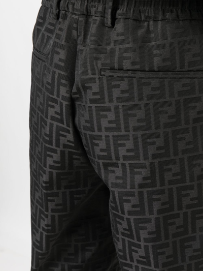 Shop Fendi Ff Pattern Tapered Trousers In Black