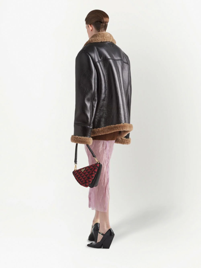 Shop Prada Oversized Shearling Jacket In Schwarz