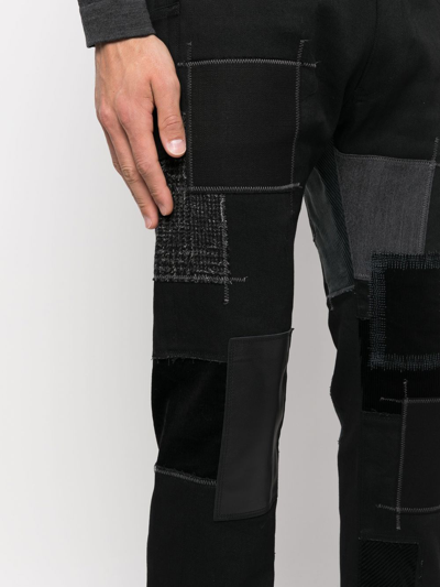 补丁设计棉质皮质牛仔裤