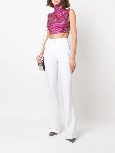 Shop Genny High-waisted Flared Trousers In Neutrals