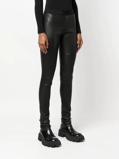 Shop Drome Skinny-cut Lambskin Trousers In Black
