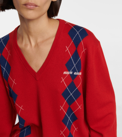 Shop Miu Miu Argyle Cashmere Sweater In Rosso