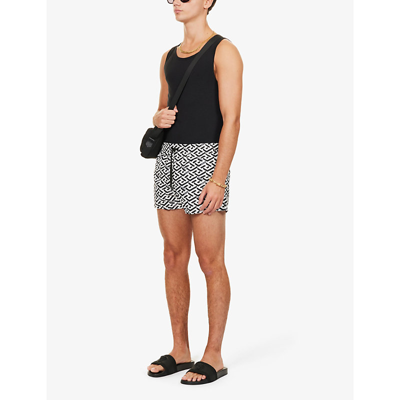 Shop Versace La Greca Monogram-print Swim Shorts In White+ Black