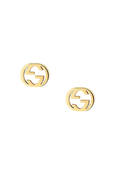 Shop Gucci Interlocking G Butterfly Clasp Earrings In Yellow Gold