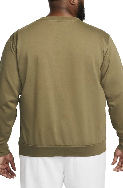 Shop Nike Dri-fit Standard Issue Crewneck Sweatshirt In Medium Olive/ Pale Ivory