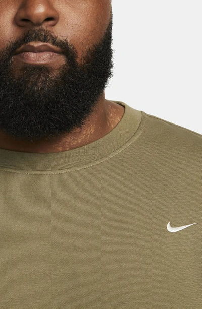 Shop Nike Dri-fit Standard Issue Crewneck Sweatshirt In Medium Olive/ Pale Ivory