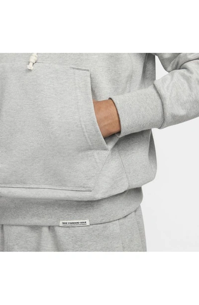 Shop Nike Dri-fit Standard Issue Hoodie Sweatshirt In Dark Grey Heather/ Pale Ivory