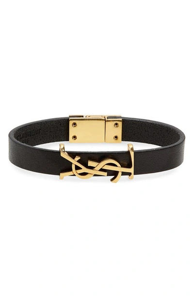 Shop Saint Laurent Ysl Insignia Leather Bracelet In Black/ Gold