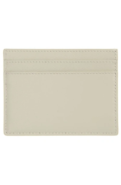 Shop Saint Laurent Logo Embossed Leather Card Case In Crema Soft