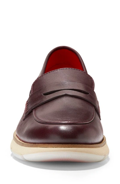 Shop Cole Haan 4.zerogrand Penny Loafer In Pinot/ Oat