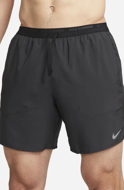 Shop Nike Dri-fit Stride 7-inch Brief-lined Running Shorts In Black/ Black