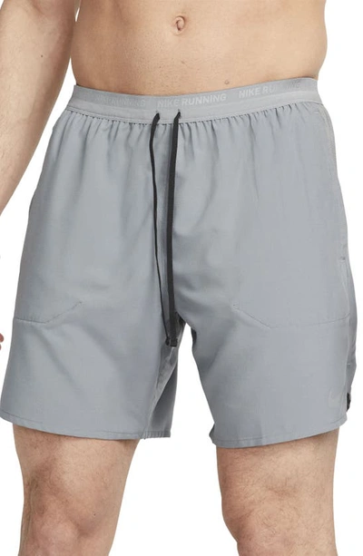 Shop Nike Dri-fit Stride 7-inch Brief-lined Running Shorts In Smoke Grey/ Black
