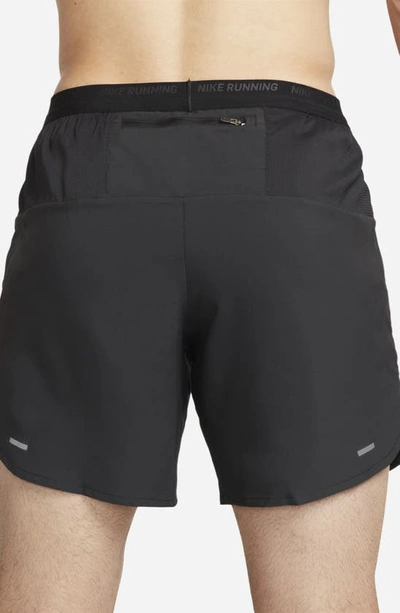 Shop Nike Dri-fit Stride 7-inch Brief-lined Running Shorts In Black/ Black