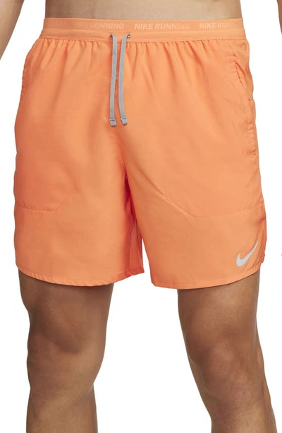 Shop Nike Dri-fit Stride 7-inch Brief-lined Running Shorts In Orange Trance/particle Grey