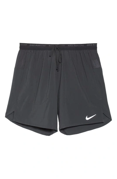 Shop Nike Dri-fit Stride 7-inch Brief-lined Running Shorts In Black/ Black