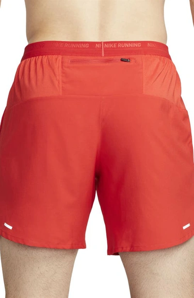 Shop Nike Dri-fit Stride 7-inch Brief-lined Running Shorts In University Red/ Black