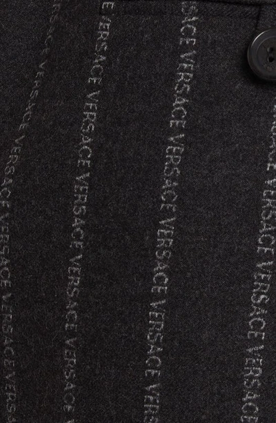 Shop Versace Pleated Pinstripe Logo Wool Blend Miniskirt In Charcoal Melange