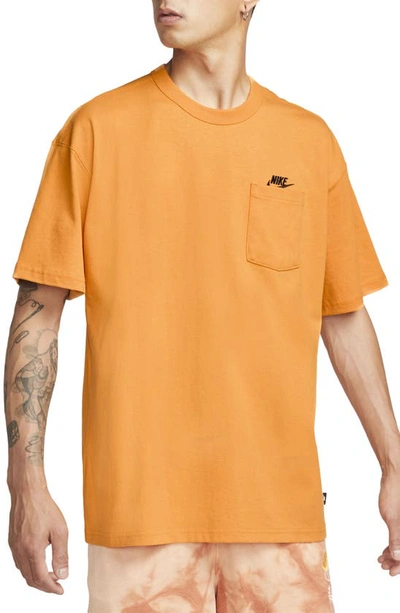 Shop Nike Sportswear Premium Essentials Pocket T-shirt In Kumquat/ Black