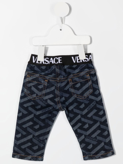 Shop Versace La Greca-print Straight-leg Jeans In Blue