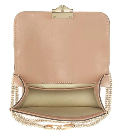 Shop Valentino Garavani Lock Mini Leather Shoulder Bag