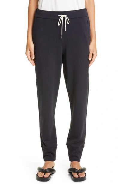 Shop Jil Sander Embroidered Cotton French Terry Joggers In Navy