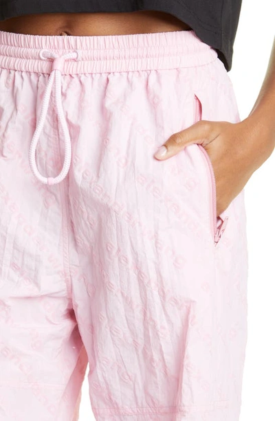 Shop Alexander Wang Flocked Logo Nylon Track Pants In Light Pink