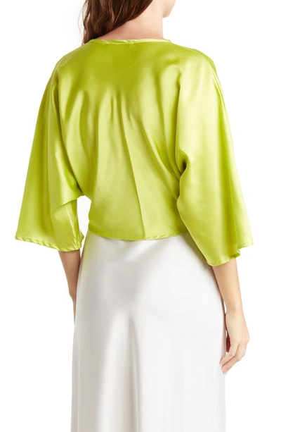 Shop Renee C Plunge Neck Long Sleeve Twisted Knot Satin Top In Citron