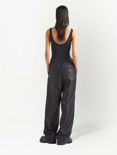 Shop Prada Re-nylon Wide-leg Trousers In Schwarz