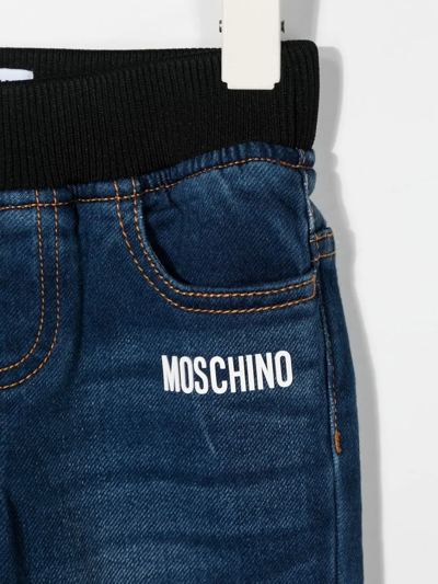 Shop Moschino Logo-print Denim Pants In Blue