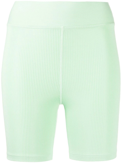 The Upside Solstice Mid Rise Spin Shorts In Green