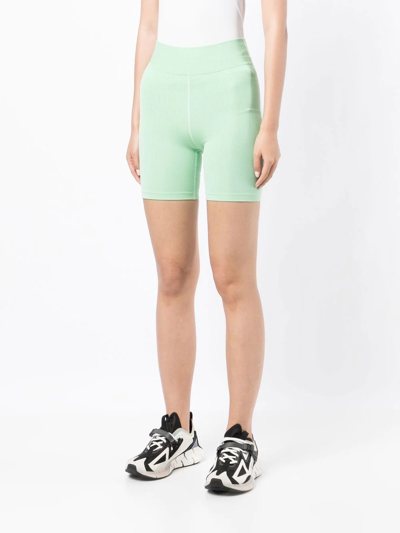 The Upside Solstice Mid Rise Spin Shorts In Green