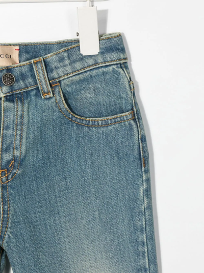 Shop Gucci Logo-print Slim-cut Jeans In Blue