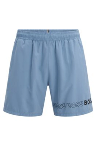 Shop Hugo Boss Swim Shorts With Repeat Logos In Light Blue